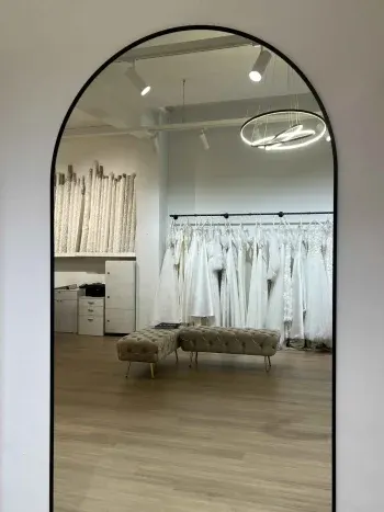 Oversized black-framed arch-top mirror — The Boss